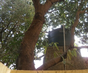 An overhead water tank in my neighbour's premises